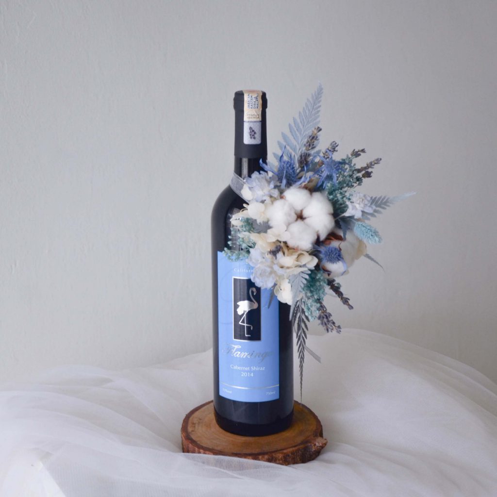 Blue Theme Affordable Wine Bottle Flower by AfterRainFlorist, PJ Florist.