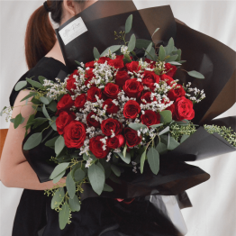 Red Roses Mix with Eucalyptus Leaf & Caspia wrapped in Black Paper