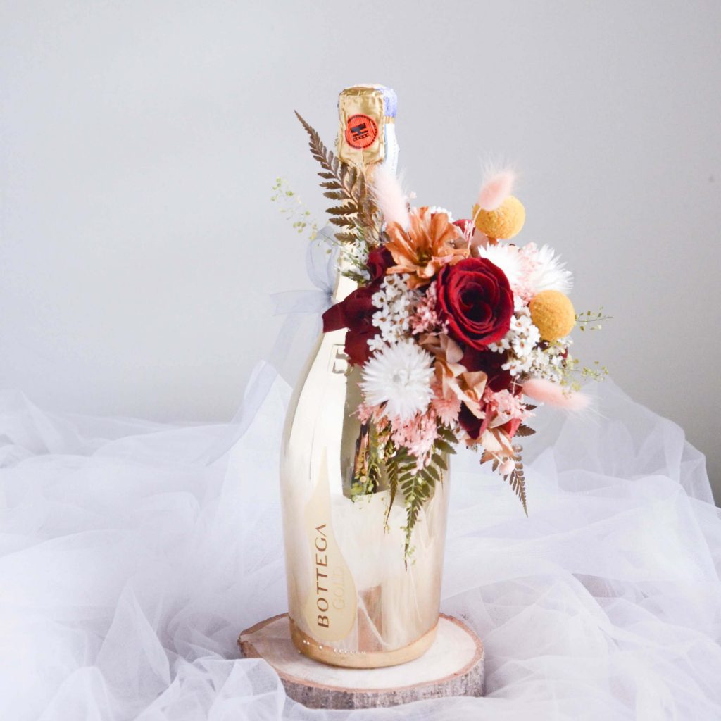 Le Gold wine Bottle Flower by AfterRainFlorist, PJ Florist